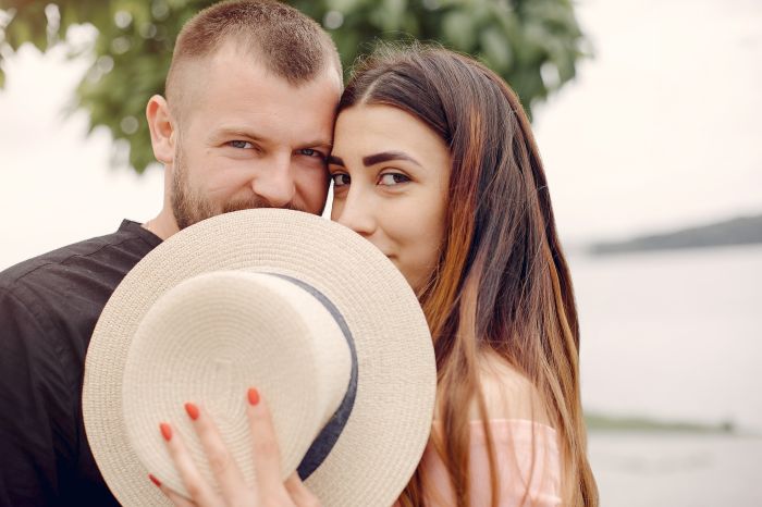 Beautiful couple spend time in a summer park