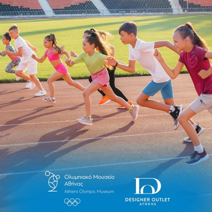 A large group of children, boys and girls, run and play sports at the stadium during sunset. A healthy lifestyle