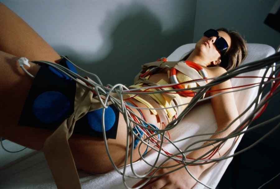 Woman Lying Down with Electrodes and Wires on Body in the Ken Club