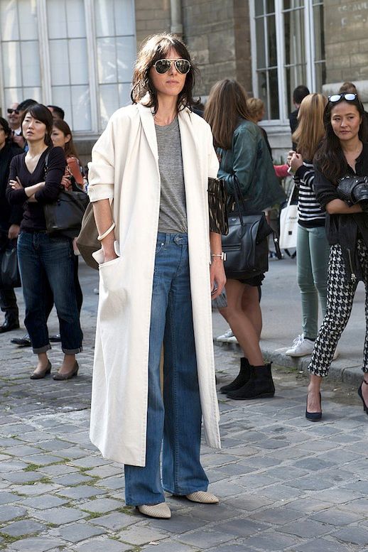 Le Fashion Blog Street Style Pfw Aviator Sunglasses White Maxi Jacket Grey Tee Wide Leg Jeans Pointy Toe Textured Boots Via Popsugar