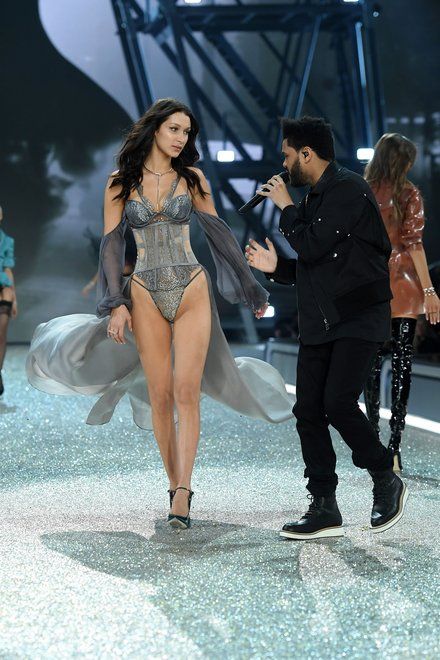 holding bella hadid the weeknd vs fashion show