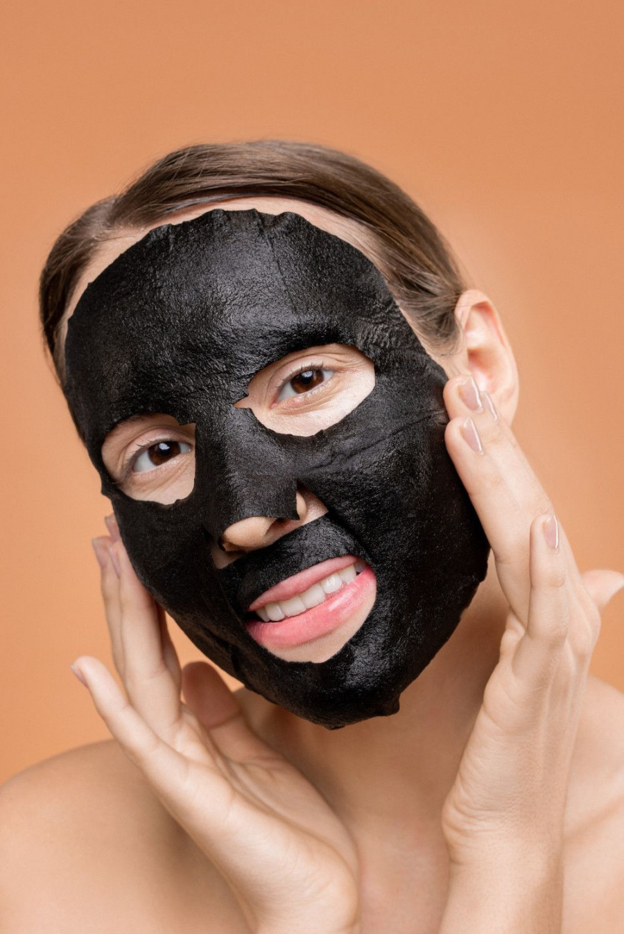 person covering face with black mask 3762559