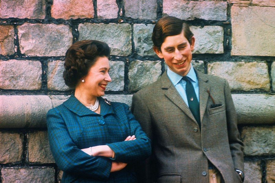 Prince Charles and Queen Elizabeth Standing by Wall