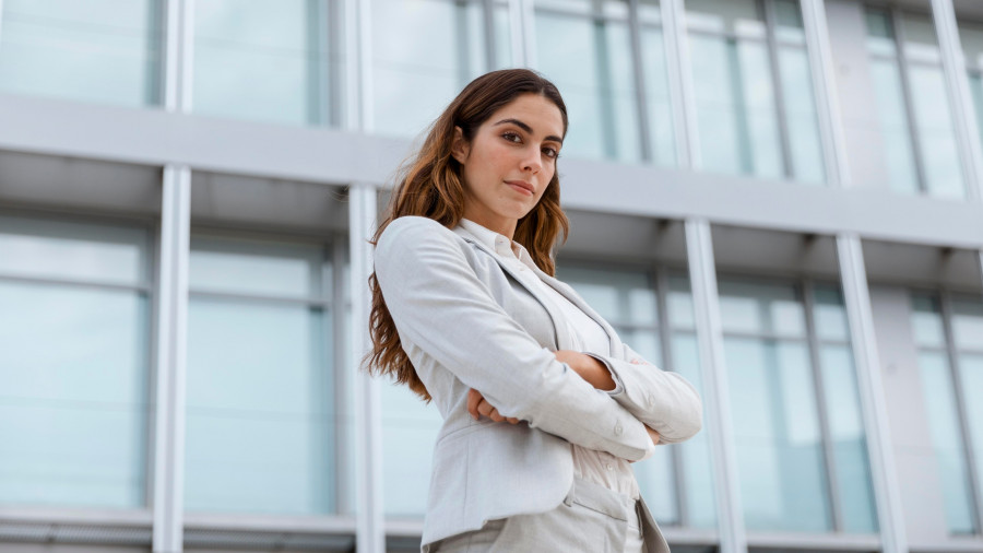 low-angle-elegant-businesswoman-posing-city.jpg