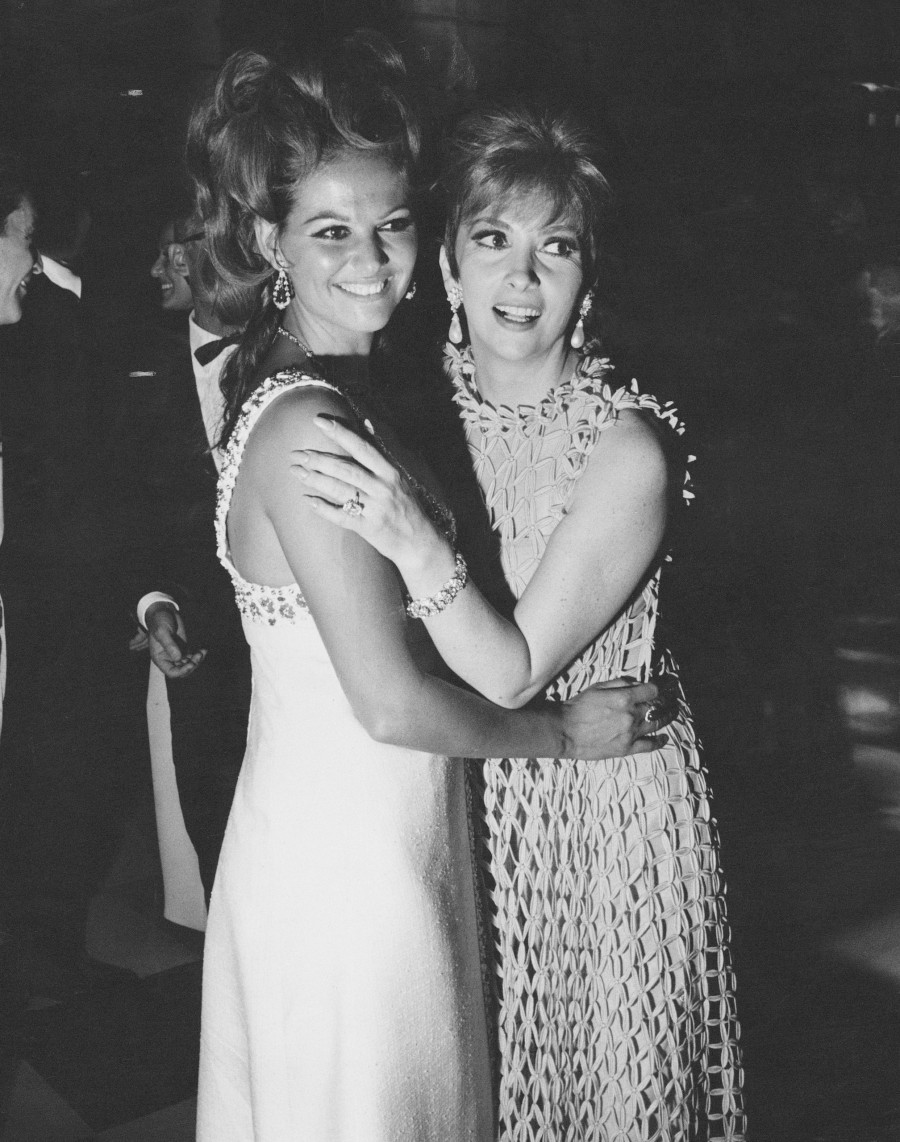 Claudia Cardinale and Gina Lollobrigida attending a party held by the Counts Cicogna