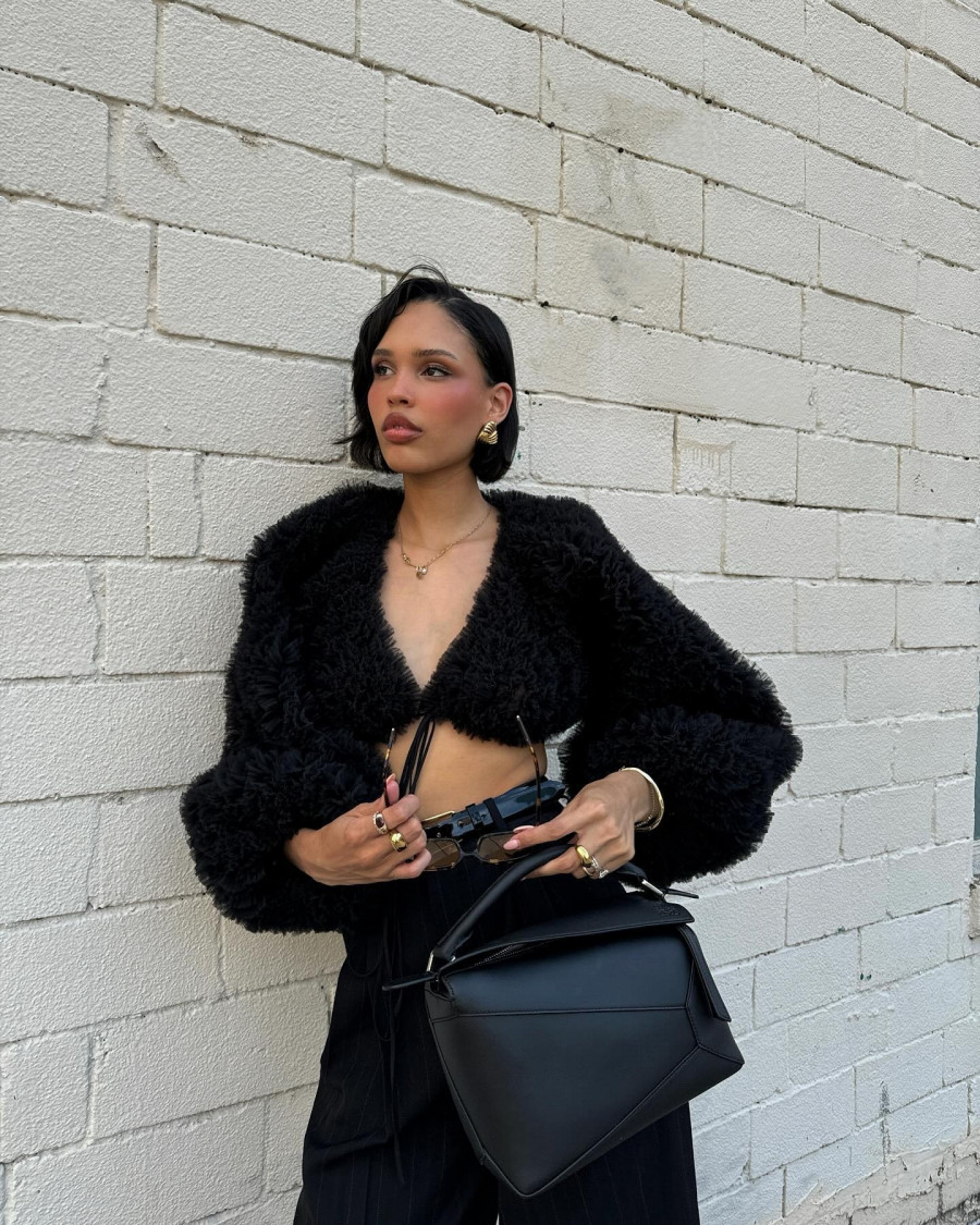 Photo-shared-by-nara-on-July-16-2024-tagging-@loewe-and-@ysl.-May-be-an-image-of-1-person-fur-purse-and-text..jpg