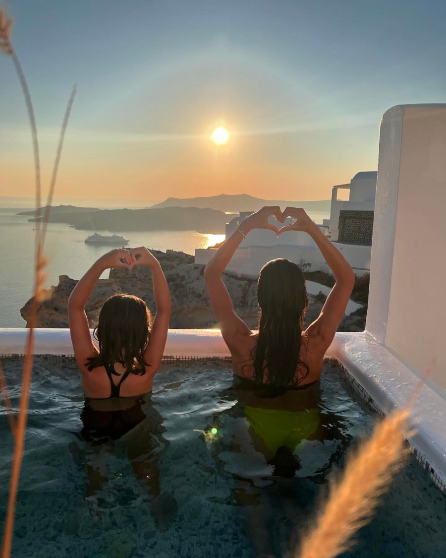 Photo-by-Ivi-Adamou-on-July-26-2024.-May-be-an-image-of-2-people-Santorini-and-text..jpg