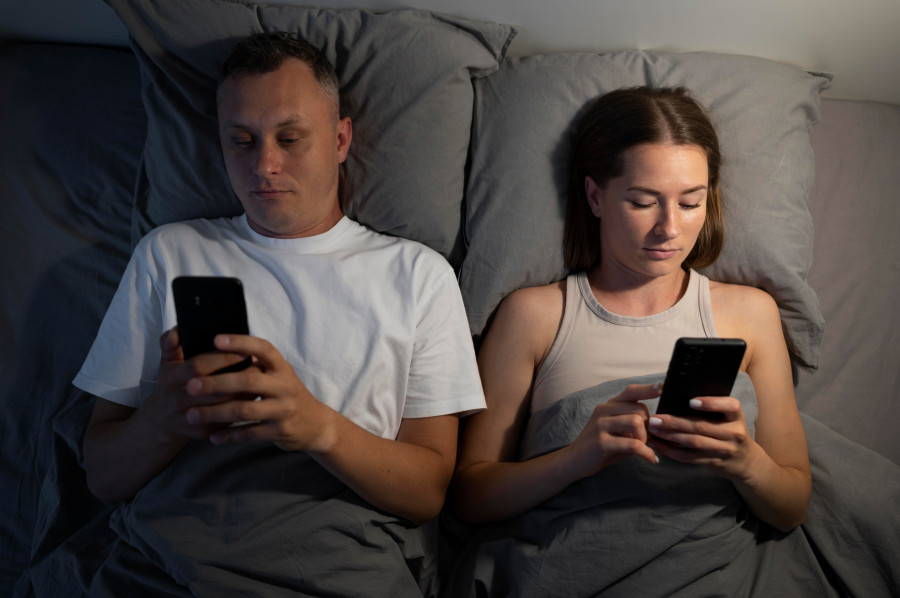 close-up-couple-phones-bedroom.jpg
