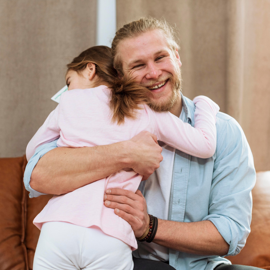 little-daughter-embracing-smiley-father.jpg