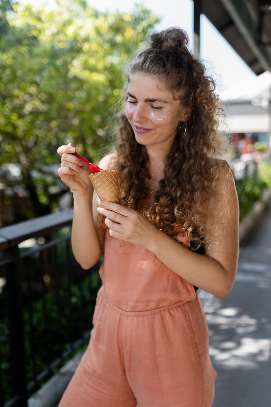 medium-shot-woman-eating-ice-cream-with-spoon.jpg