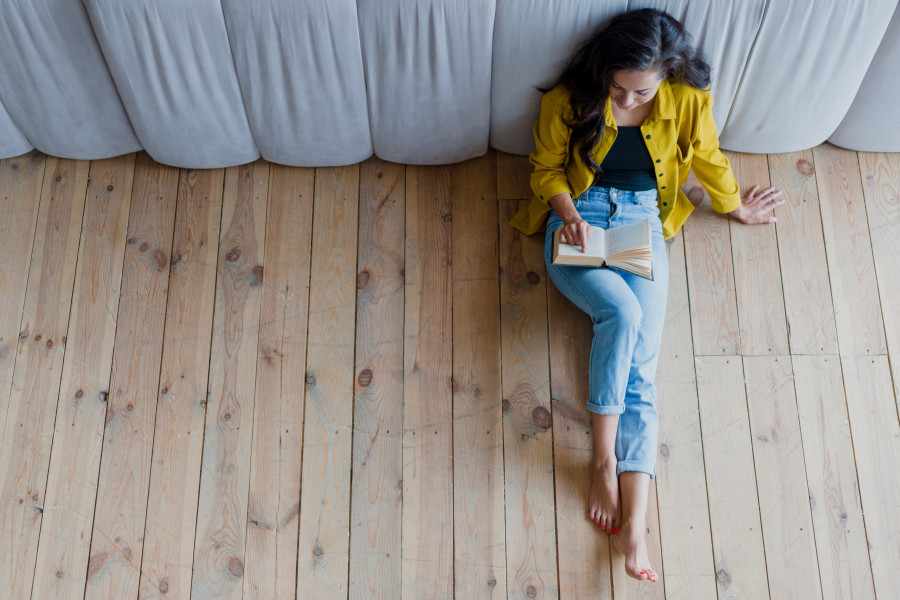 full-shot-brunette-girl-reading-book.jpg