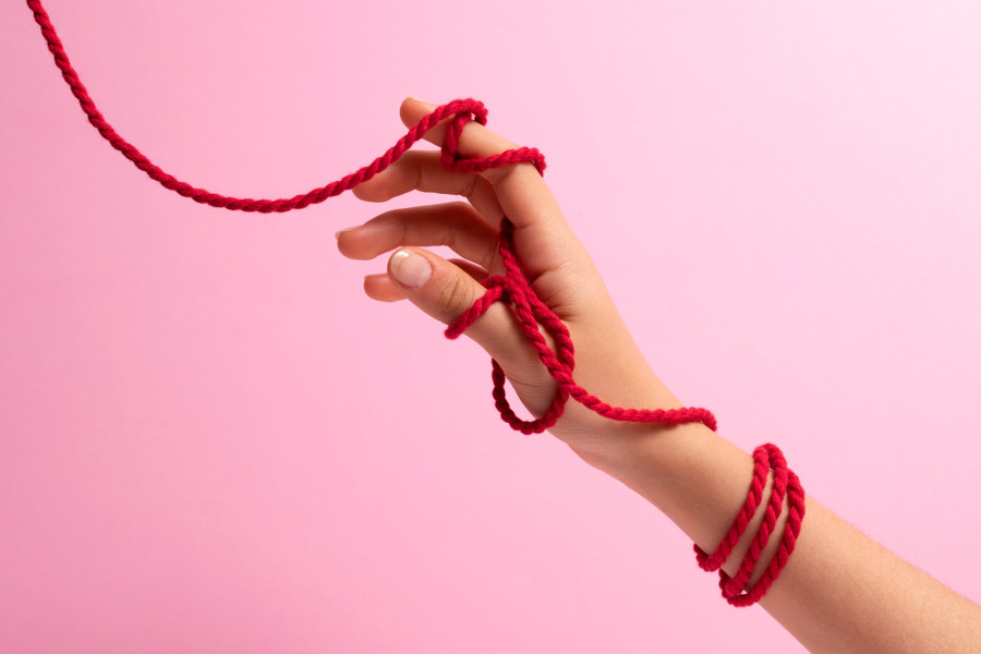 human-hands-connected-with-red-thread.jpg