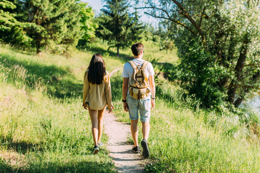 rear-view-couple-hiking-together-outdoors.jpg