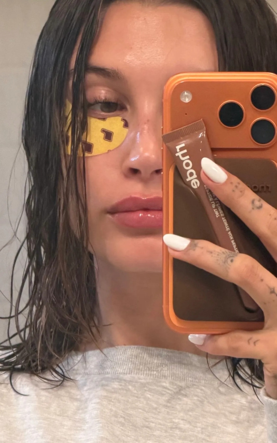 1782302645587-482982802-hailey-bieber-white-manicure.jpg